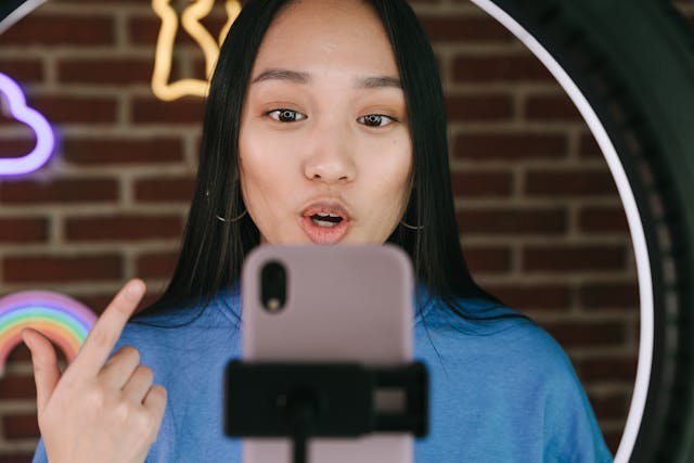A Woman Recording Herself with a Smartphone.jpg