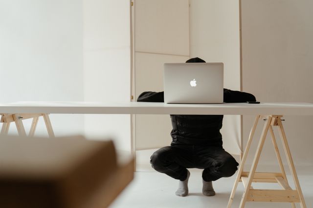 Koofr tips and tricks: A person working in a minimalistic home office