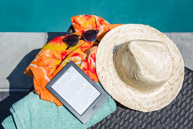Black Amazon Kindle Tablet Near Brown Drawstring Sun Hat.jpg