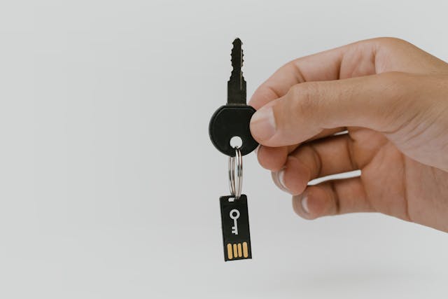 Close-Up Shot of a Person Holding a Key