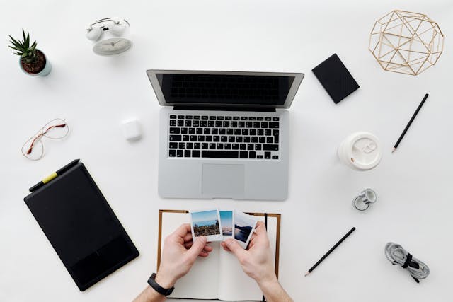 Man Hands and Office Supplies on Desk