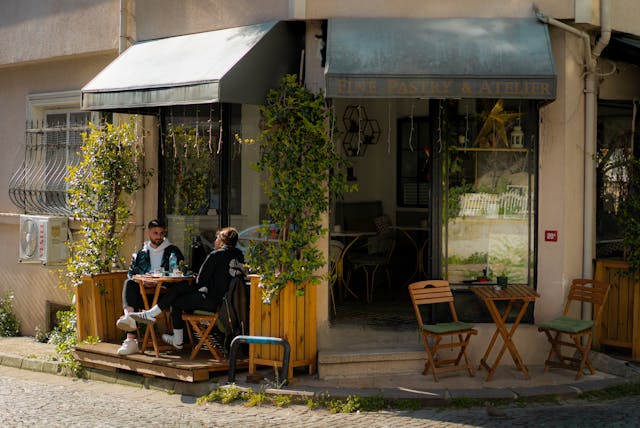 Outdoor café in Kuzguncuk, İstanbul with two people enjoying a sunny day