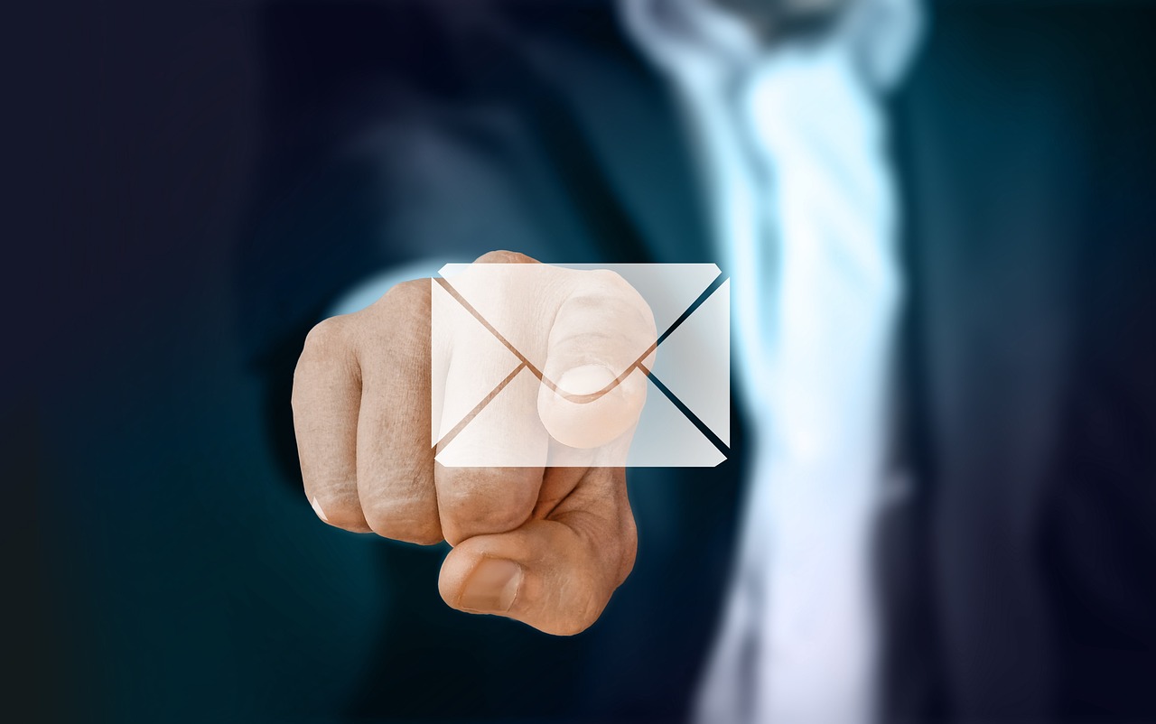 A finger pointing to an email attachment - Koofr blog phishing