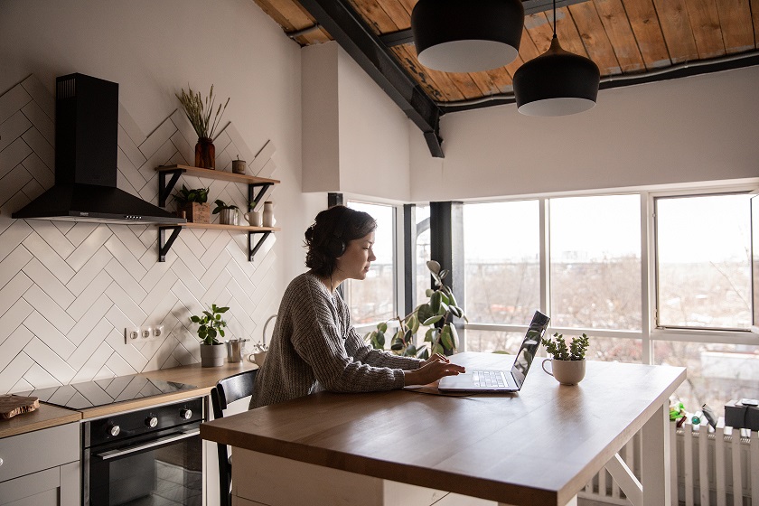 young-woman-surfing-laptop-in-kitchen-4049990.jpg